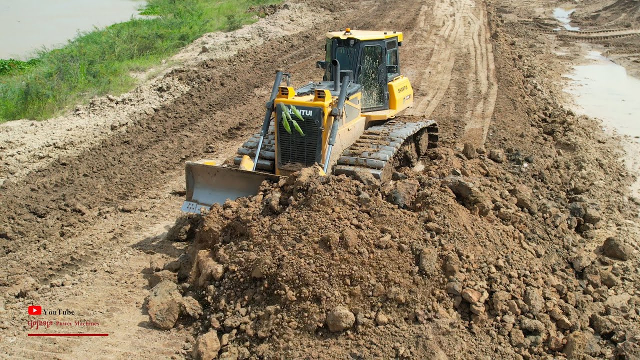 The Power Dozer Equipment Moving Building Road Hard Pushing Worker With Dump Truck Spreading