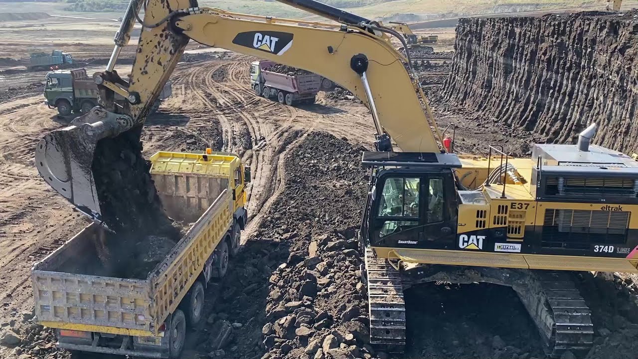 Caterpillar 374D Excavator Loading Mercedes And MAN Trucks - Interkat SA
