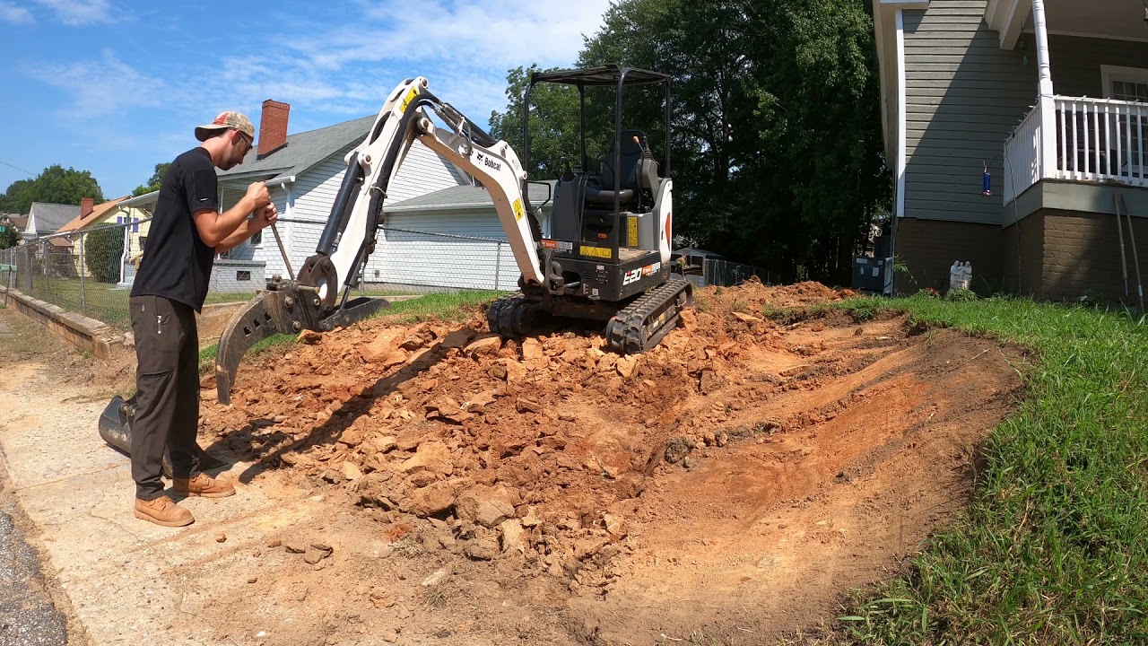 grading a driveway with bobcat e20