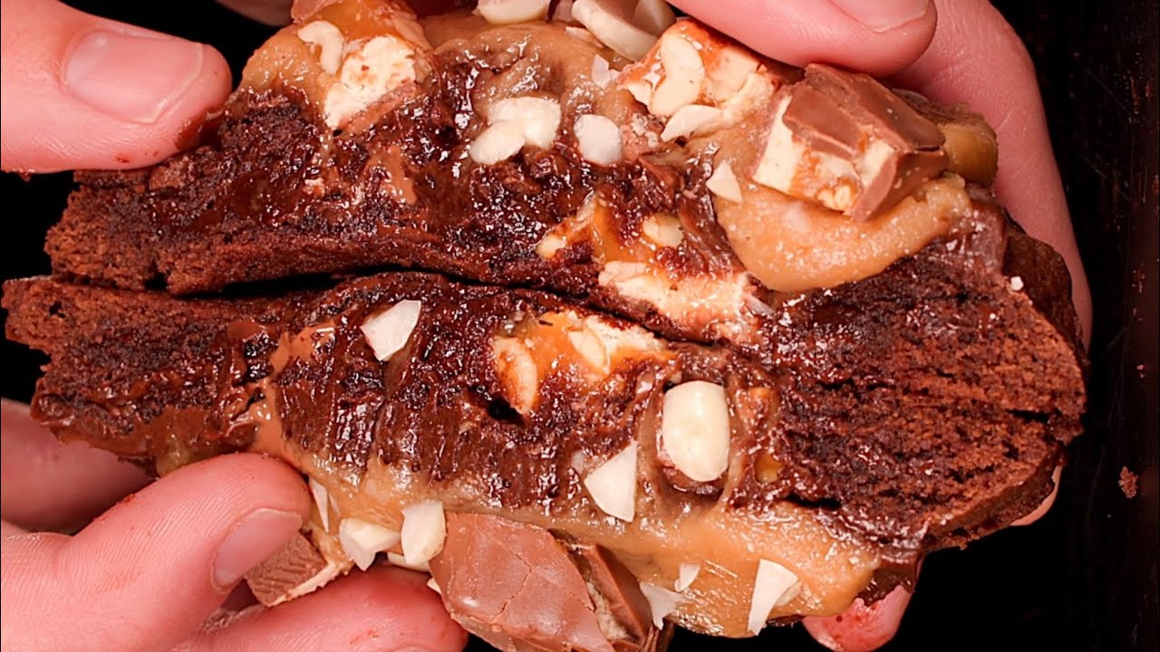 Loaded Snickers Cookie with a Caramel Topping