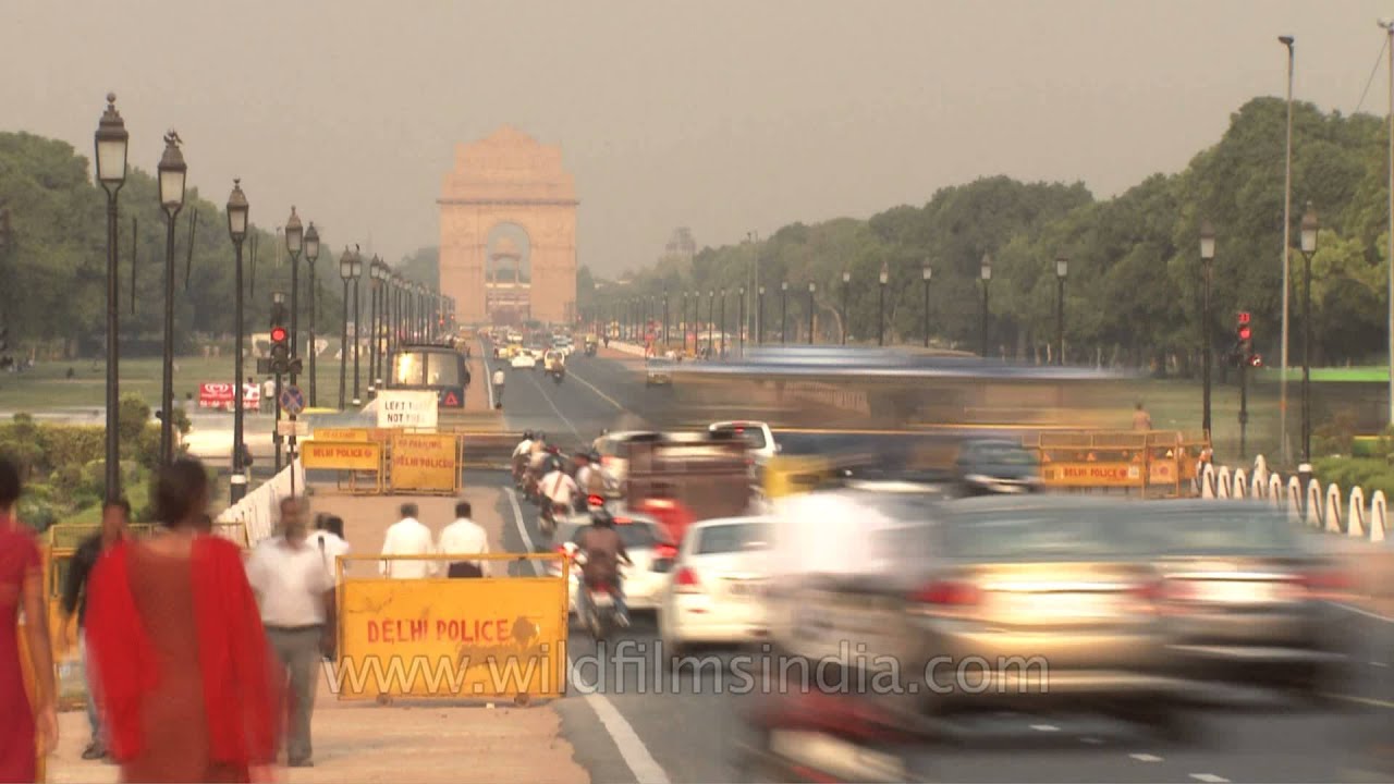 Fast motion traffic of Delhi from day to night, at India Gate