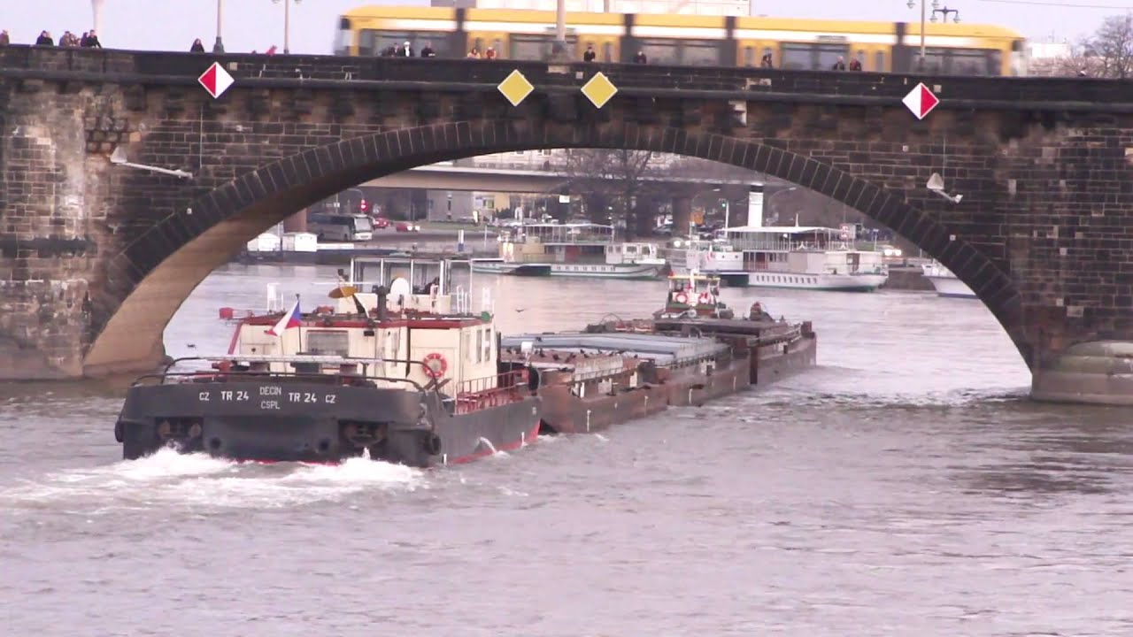 Czech tow boat on Elbe river per pilot boat
