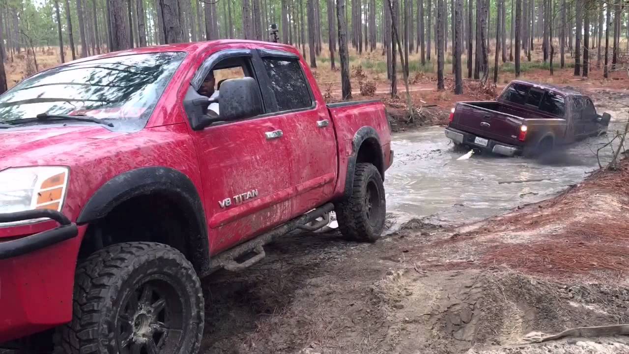 Nissan Titan pulls out Hummer H2 and Lifted F250 on 37's!! Fort Bragg Mudding Dec2015