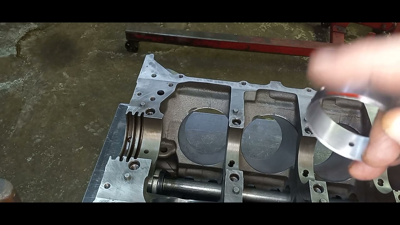 installing cam bearings in a Pontiac 400 block utilizing a recycled broom handle