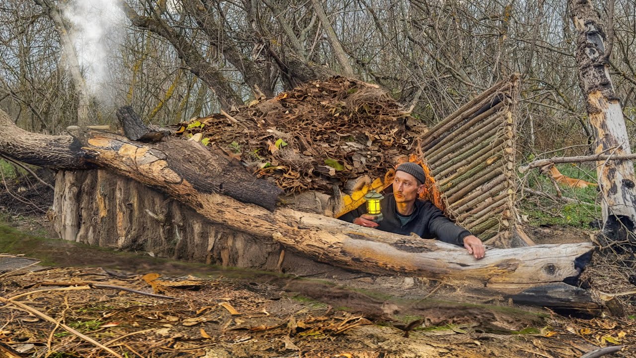 Construction of a dugout for survival. Warm stove, heated bed. Bushcraft, survival skills