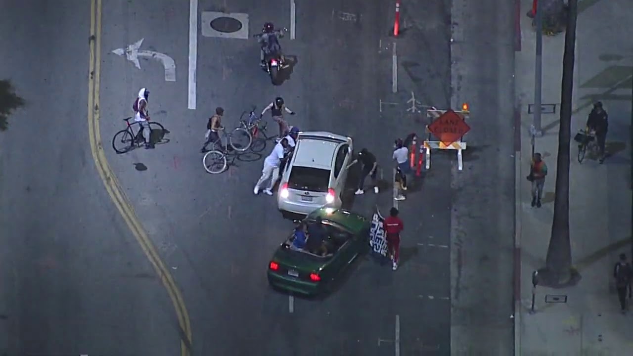 Driver attacked after driving through protest crowd in Hollywood | ABC7 Los Angeles