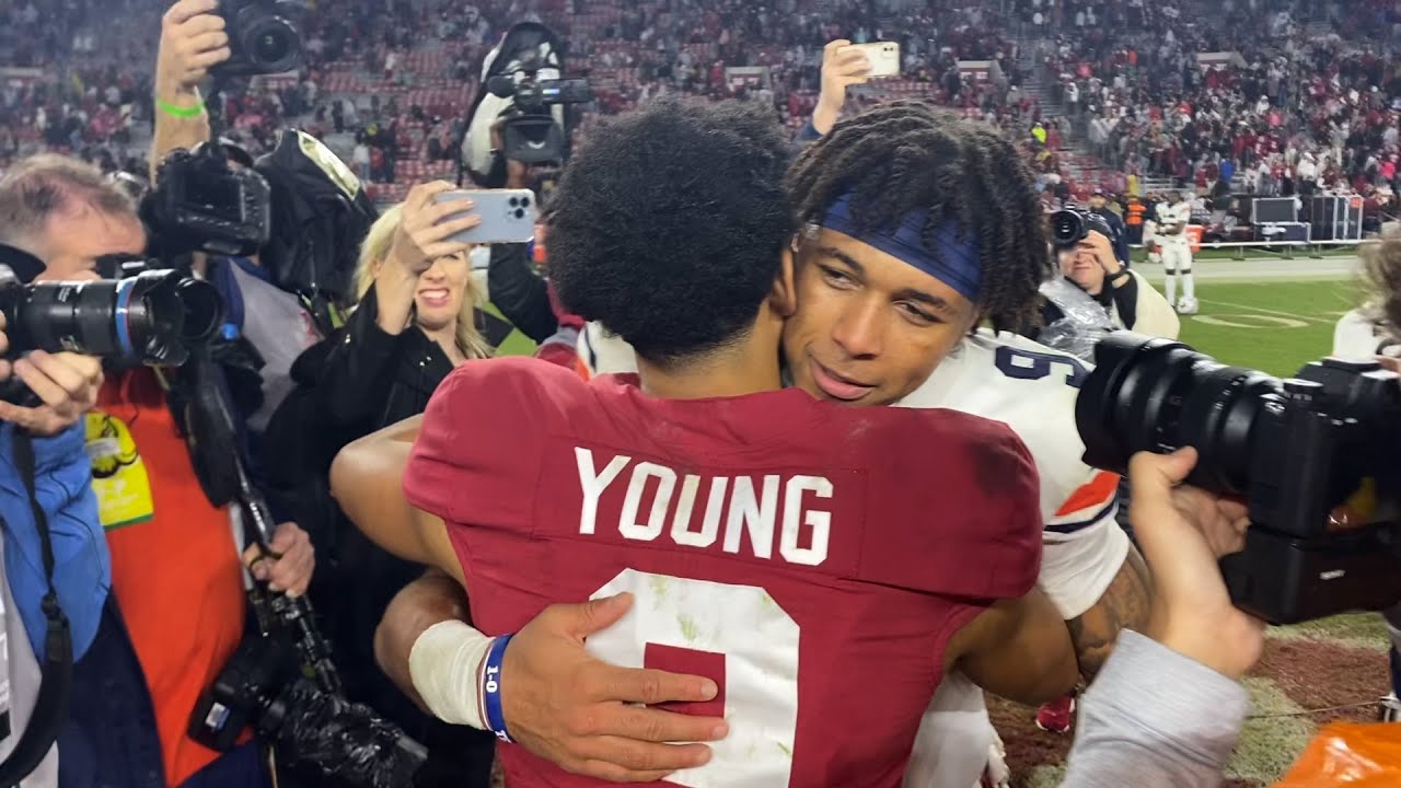 Bryce Young hugs Robby Ashford before walking off the field at Bryant-Denny to a standing ovation