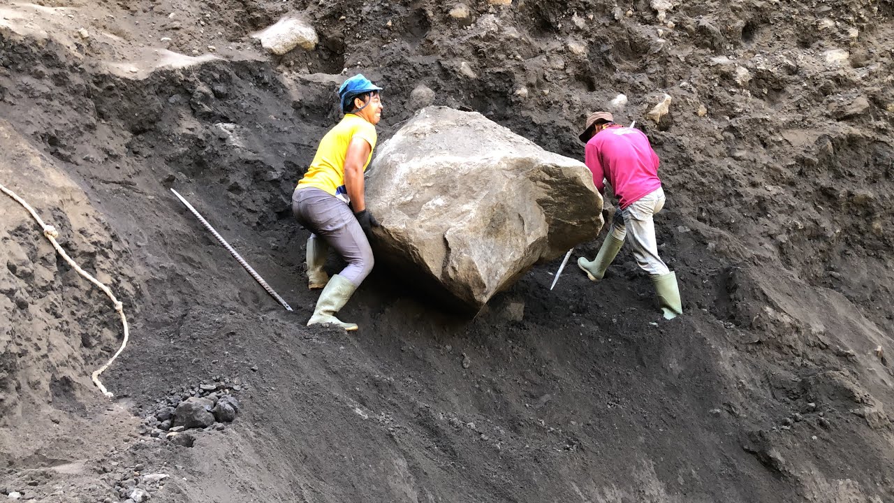 Dropping a large rock on a cliff and then crushing it below