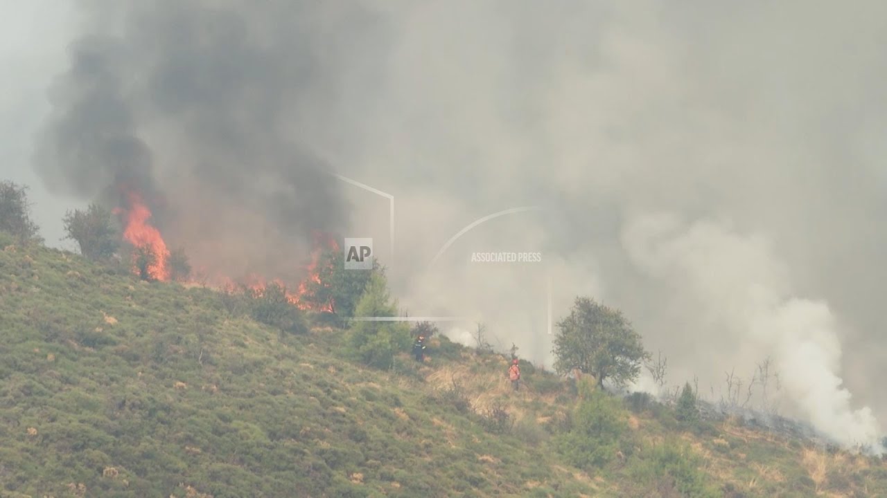 Firefighters battle a deadly forest fire that continues to rage in southern Greece for third day