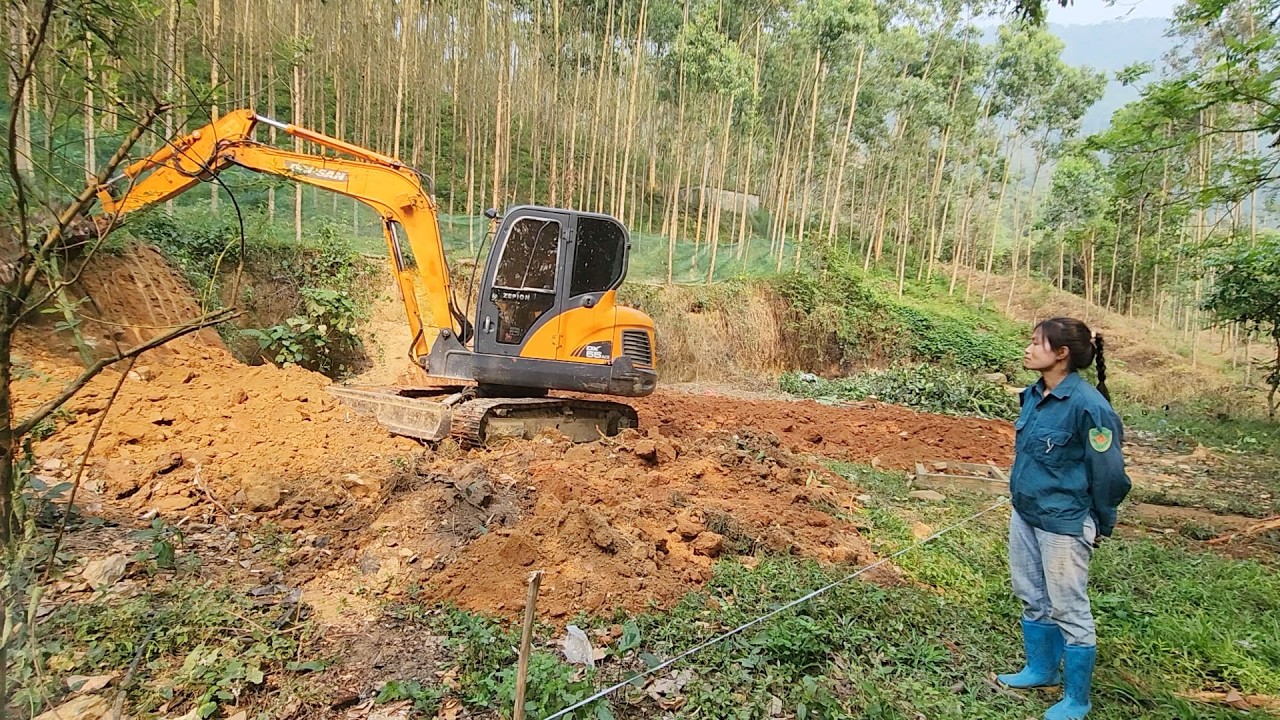 Rent an excavator to level the ground for building a house.