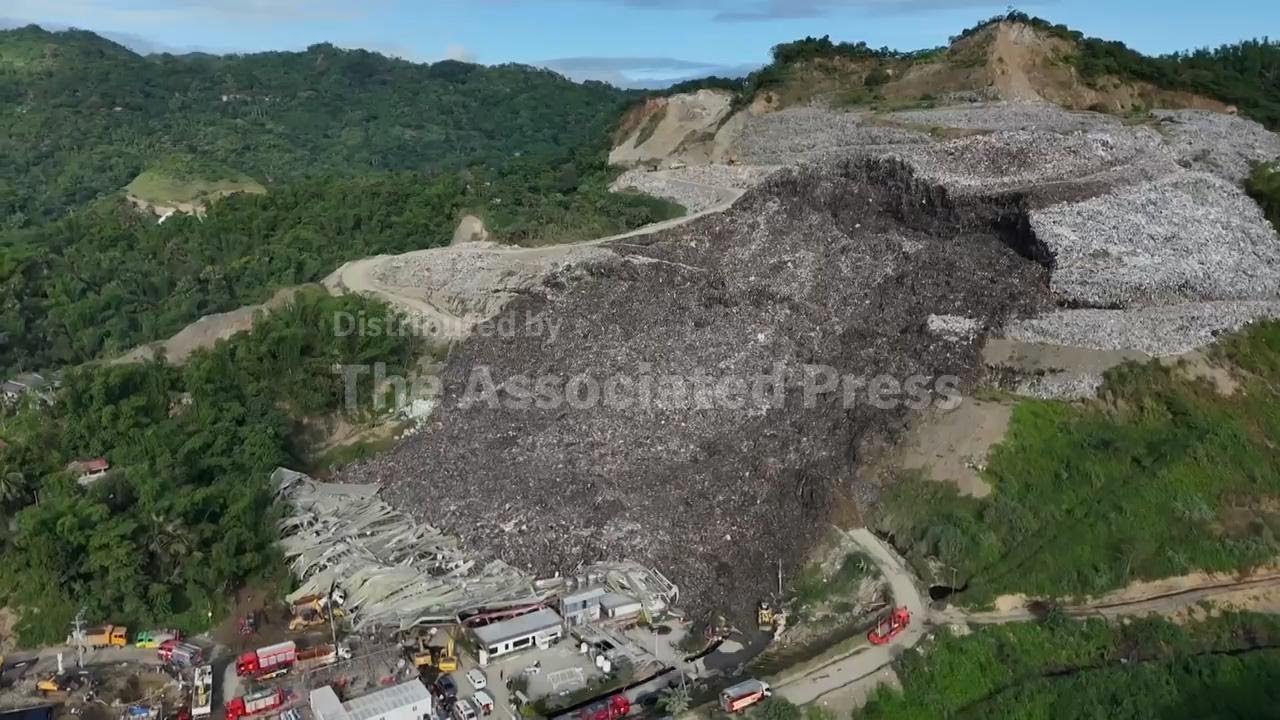 Search for dozens of workers buried under garbage after landfill collapse in central Philippines