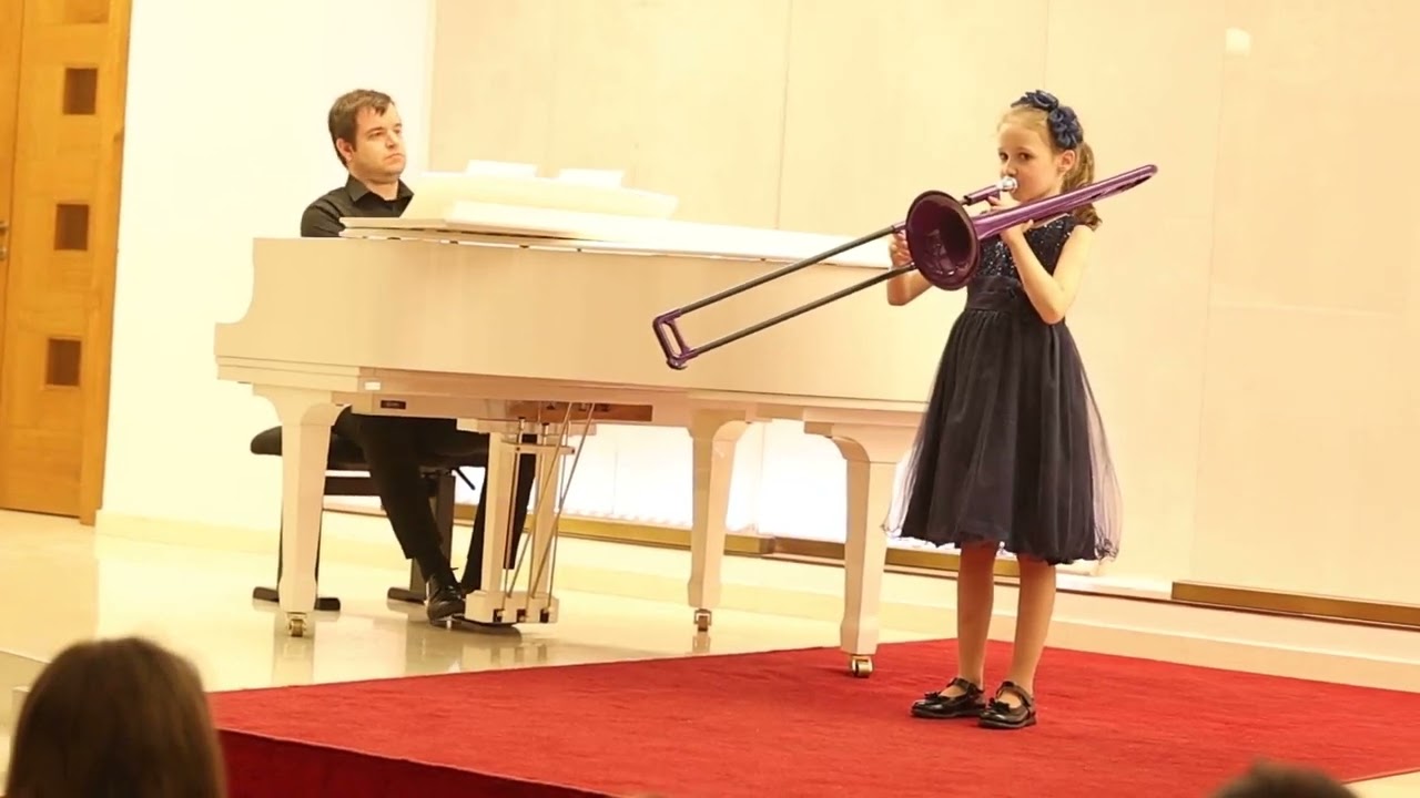 7-year-old girl playing the trombone (small compositions, Ode to Joy)
