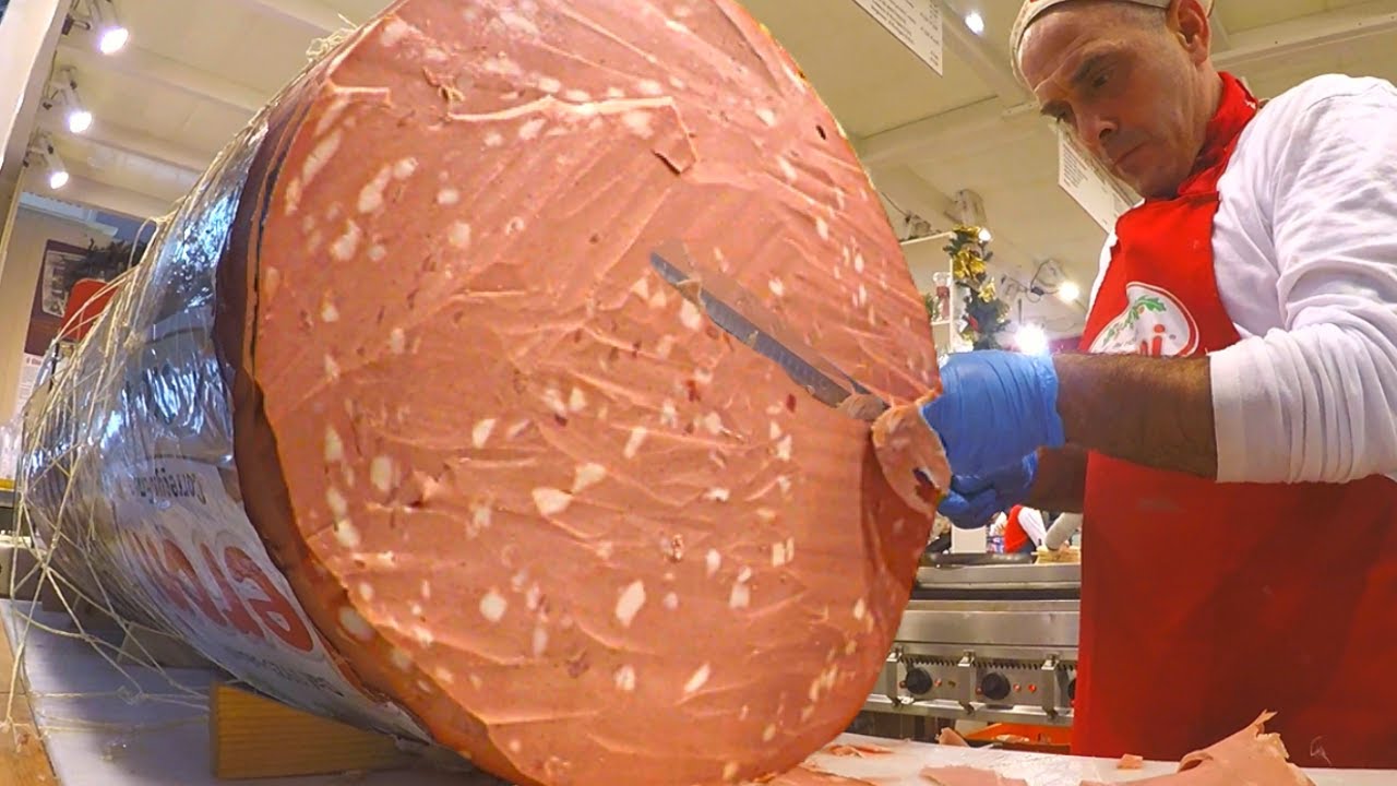 Giant Italian Salami Most Famous Mortadella Cut for 'Piadine' Flat Breads. Milan Street Food