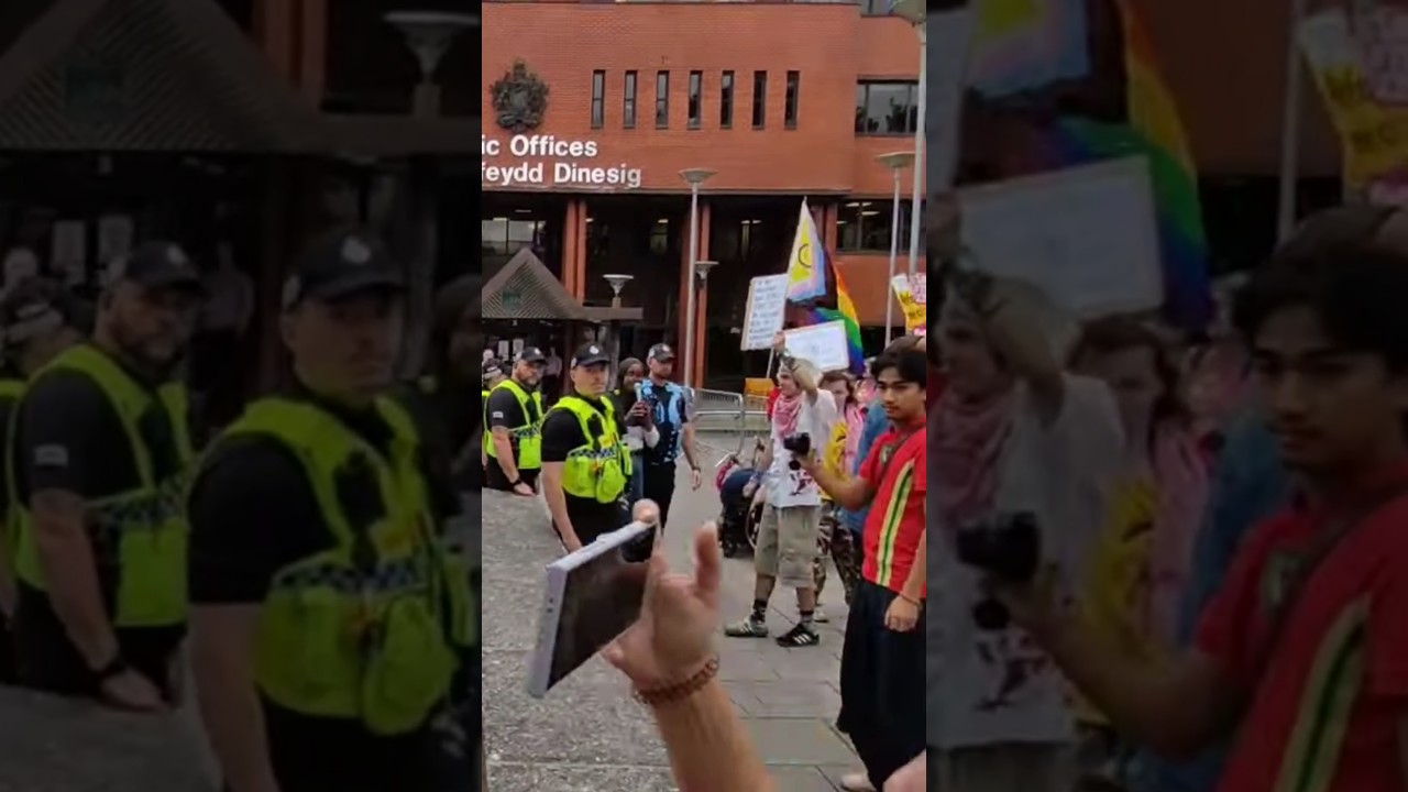 Anger erupts outside Council Offices. Protest and counter protest clash. Barry, Wales.
