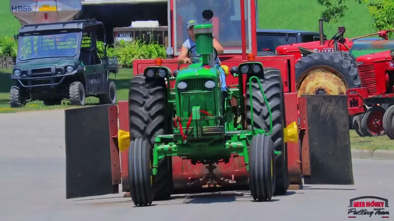 Crazy Blacktop Tractor Pulling!