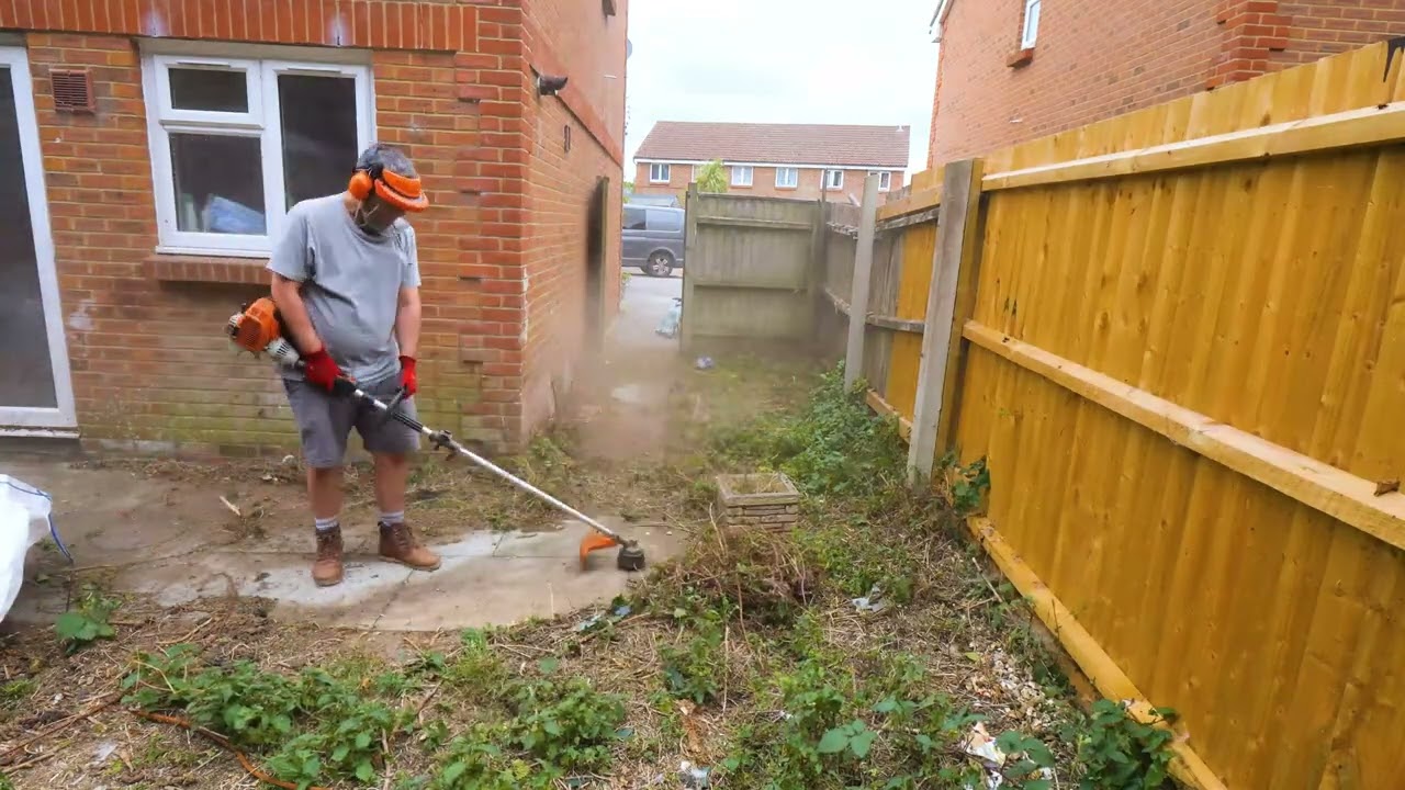Clearing The Dog Mess From Andys Garden