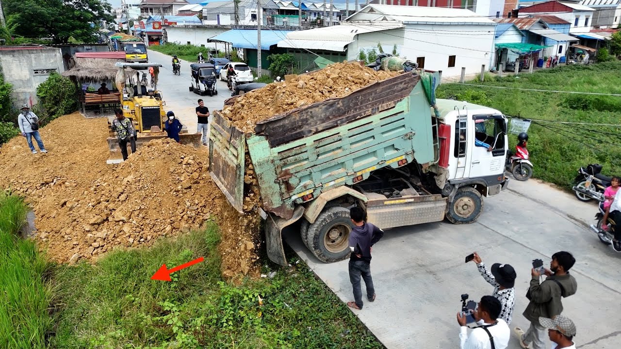 Unleashing Power How a Bulldozer & 5-Ton Dump Truck Transform Soil and Stone Clearing Land & Level