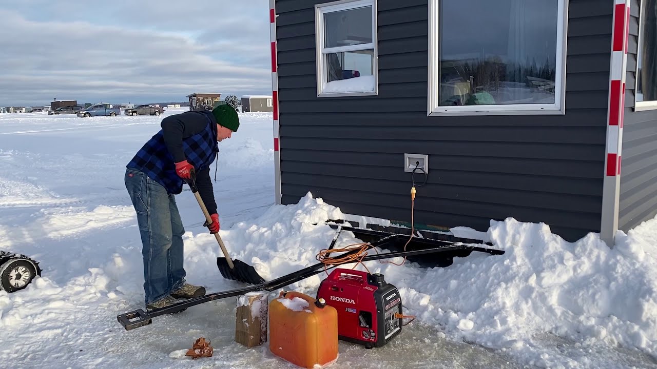 Northern Sunset - Towing, blocking and banking an ice shack for ice fishing in Canada!