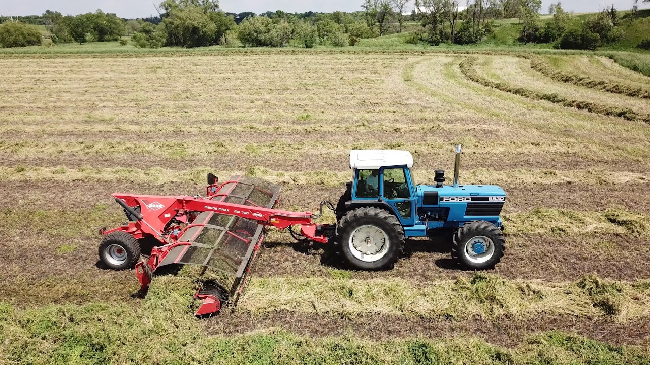 Merging massive alfalfa crop with a Ford 8830 and Kuhn Merge Maxx 700, for chopping.