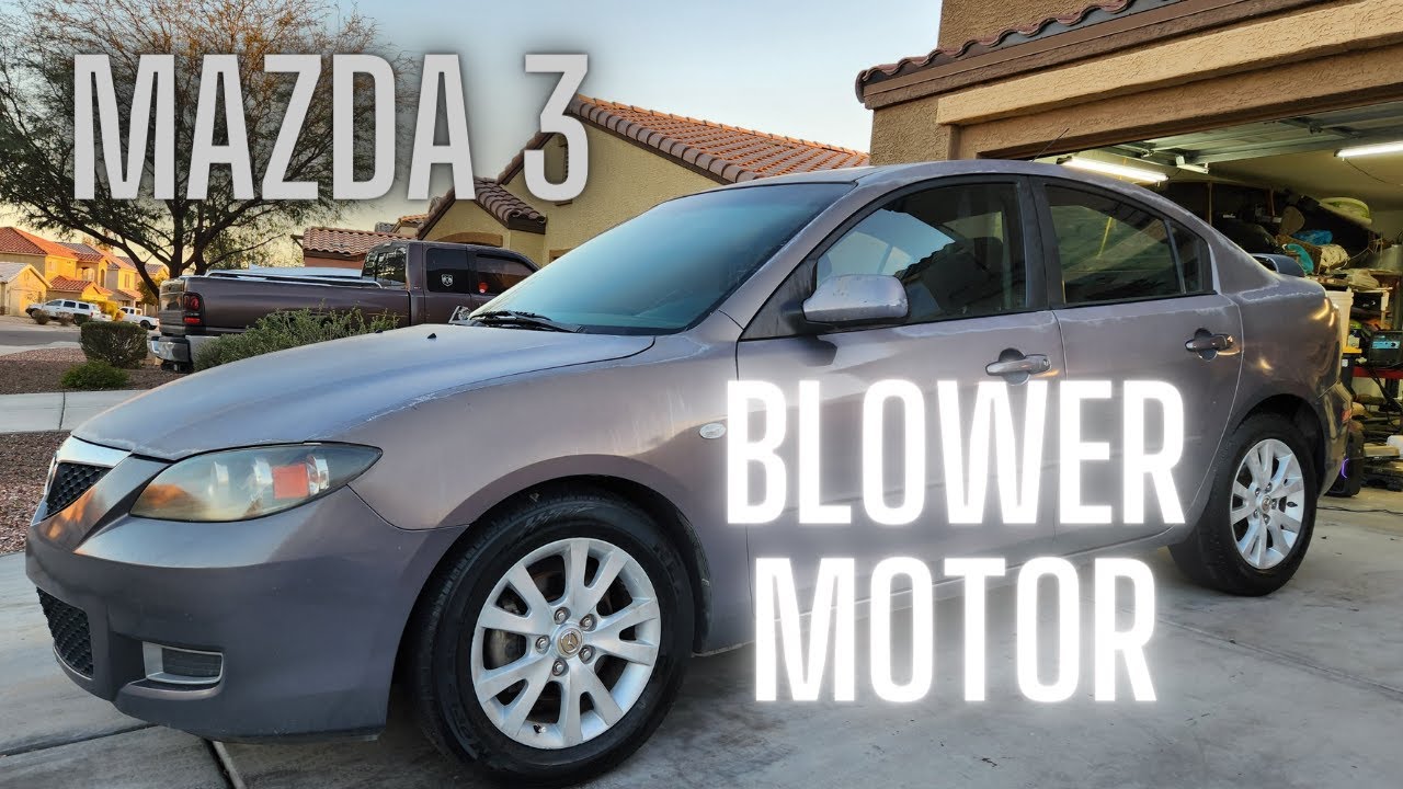 Расположение и замена электродвигателя вентилятора Mazda 3 2007 года