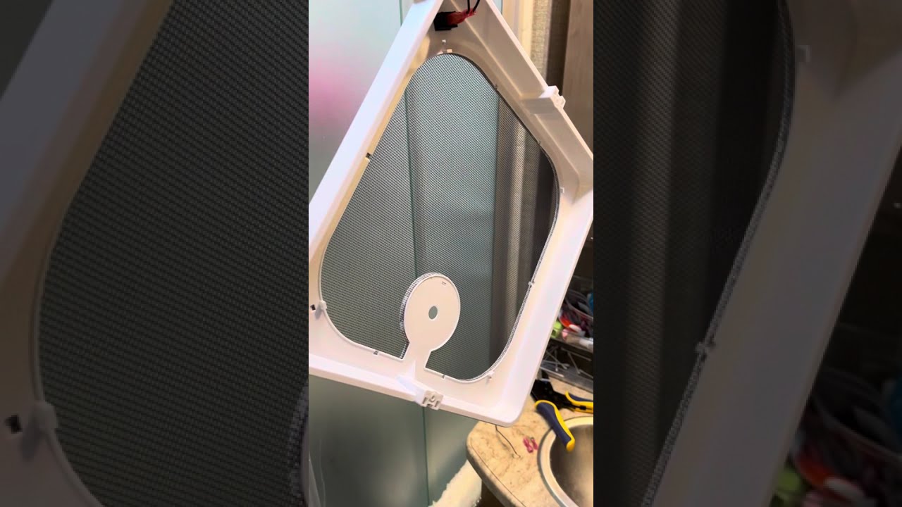 Replacing an RV bathroom fan screen and shroud