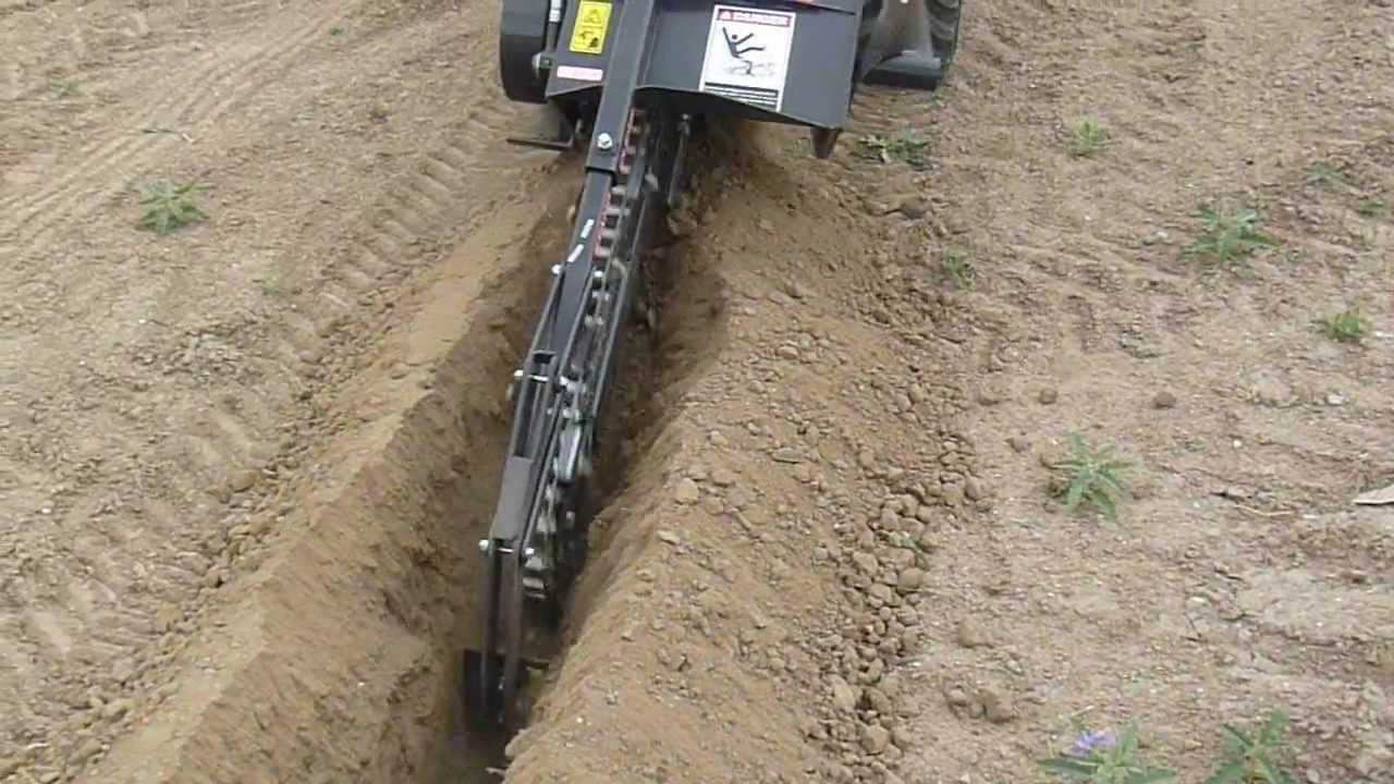Bradco Model 330 Trencher attached to a Kubota BX2660RV tractor