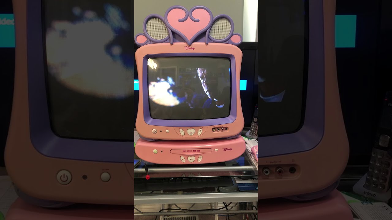 Pink Disney TV with DVD player playing movie