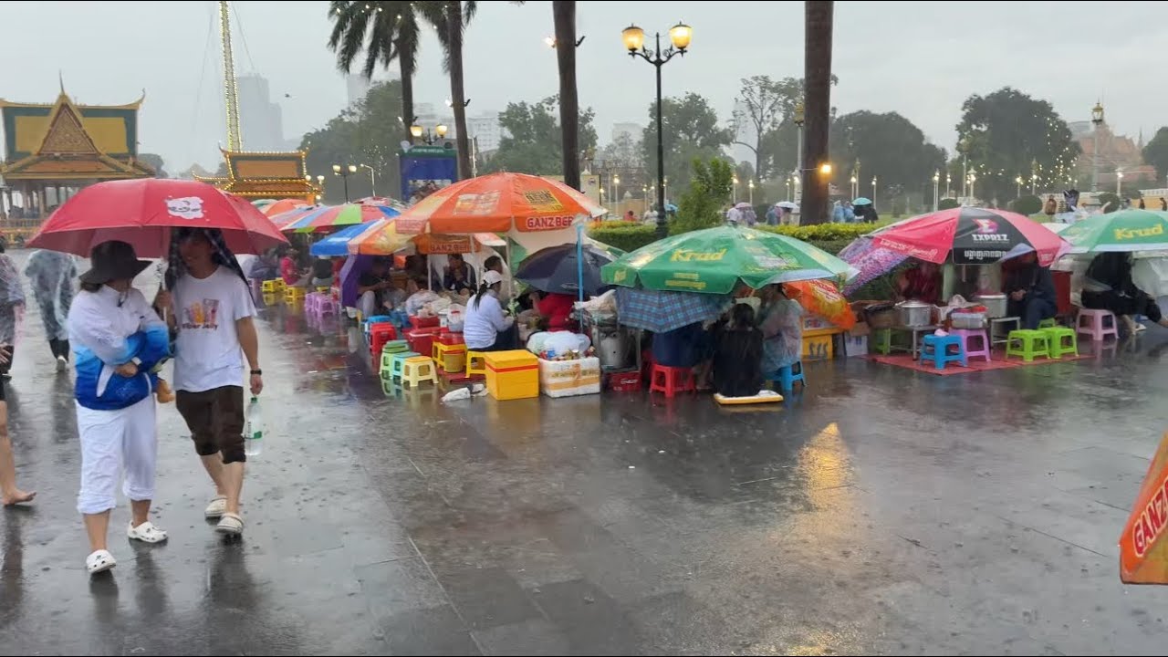 Selling Food in a Heavy Rain at Chaktomuk Walk Street , Phnom Penh City, Cambodia