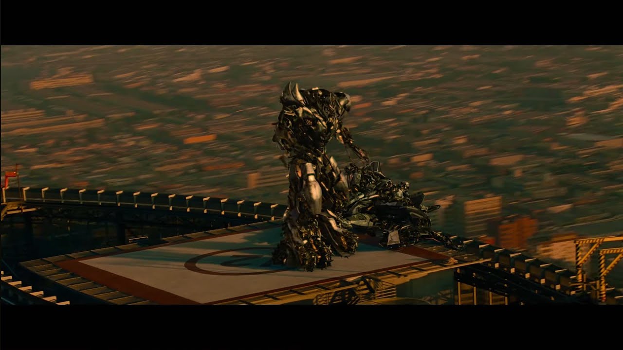 Megatron beats up Starscream (rooftop) Revenge of the Fallen.