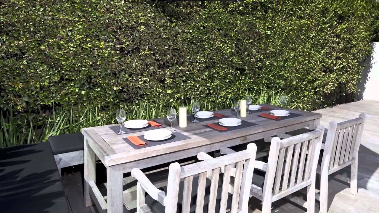 Subtle design creates a spacious minimalist feel in this outdoor living and pool area