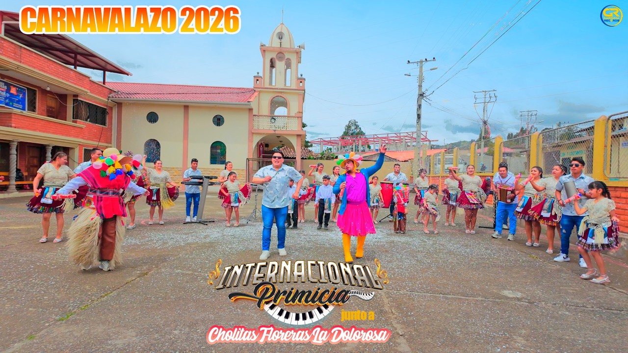 VIDEO OFICIAL CARNAVALERO ORQUESTA INTERNACIONAL PRIMICIA FT CHOLITAS FLORERAS LA DOLOROSA 2026