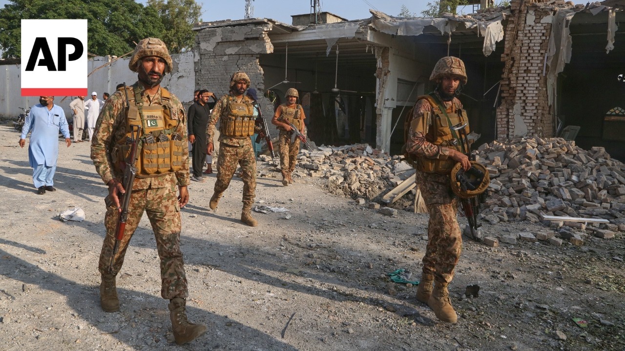 At least 21 dead in a bombing at a mosque near police offices in Pakistan