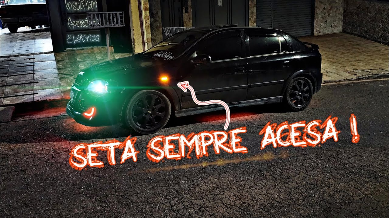 GM ASTRA - SETA DO PARALAMA ACESA COM A LANTERNA