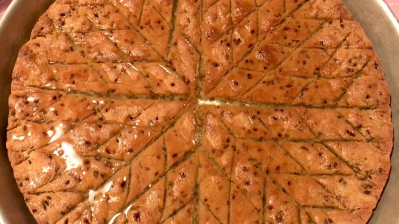 صينية حلبه فلسطينيه على أصولها بالسميد وزيت الزيتون بدون إضافات وطريقة تقطيعها على شكل نجمه!!