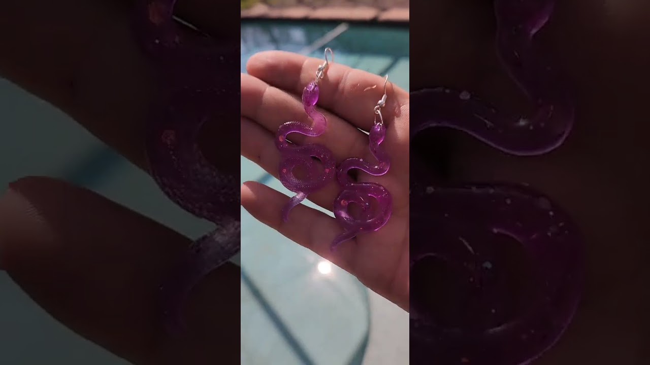 UV color changing Pink to purple snake 🐍 earrings available in my shop www.theirridatedfox.etsy.com