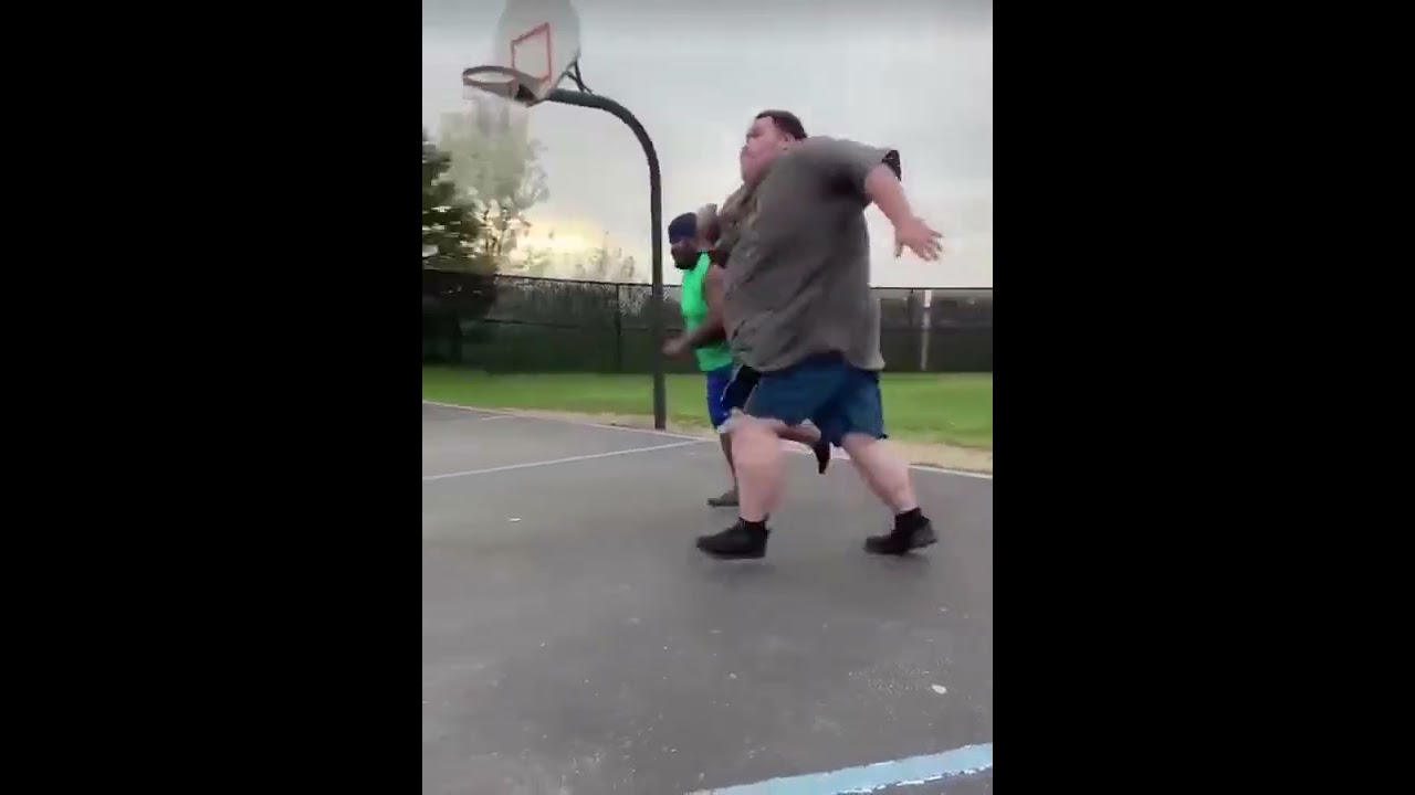 two fat people run a race! Big guy falls hard