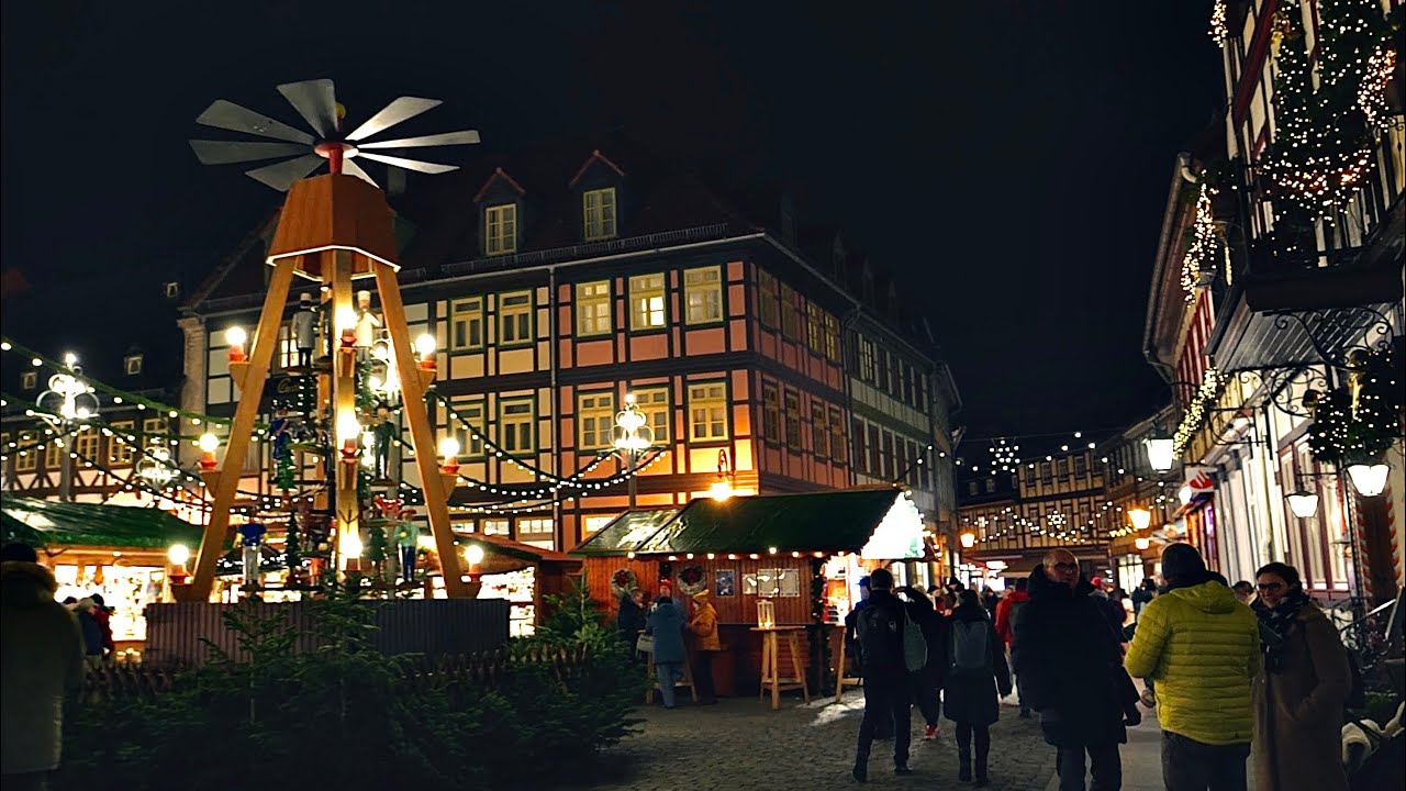 Glow of lights at Christmas market Wernigerode, walk in light snowfall in the evening 4K