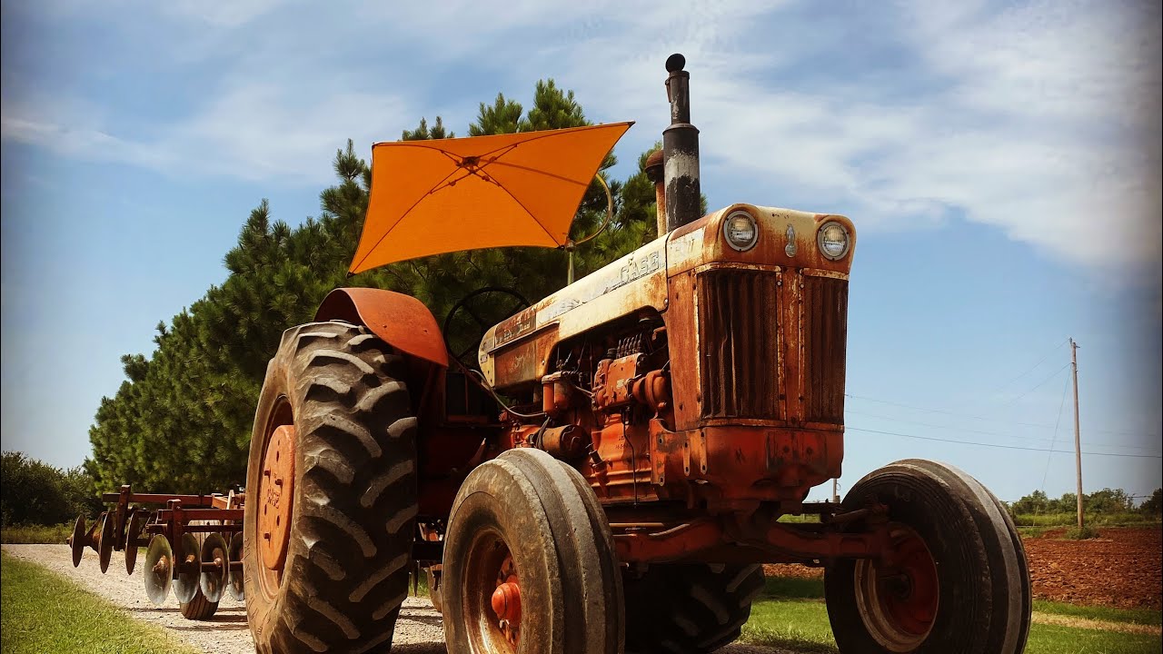 1960 930 case discing plowed ground.