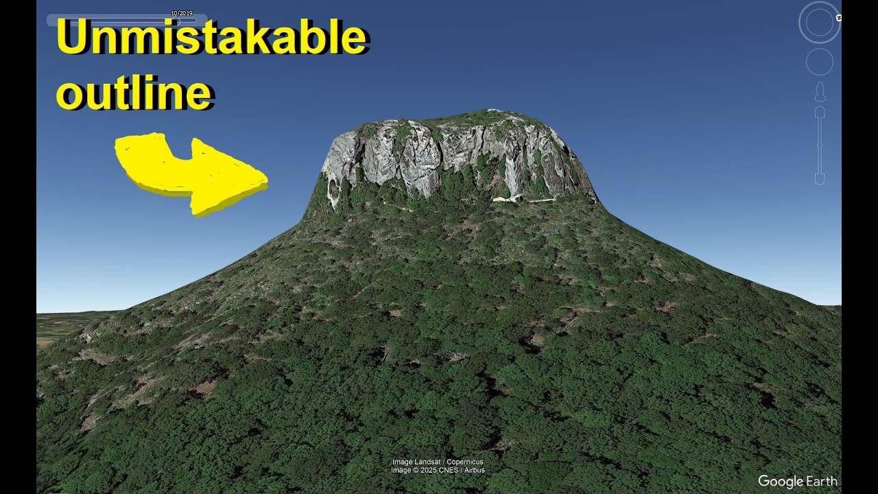 You can't walk to the top of this unique mountain peak (a tiny lost world up there?)