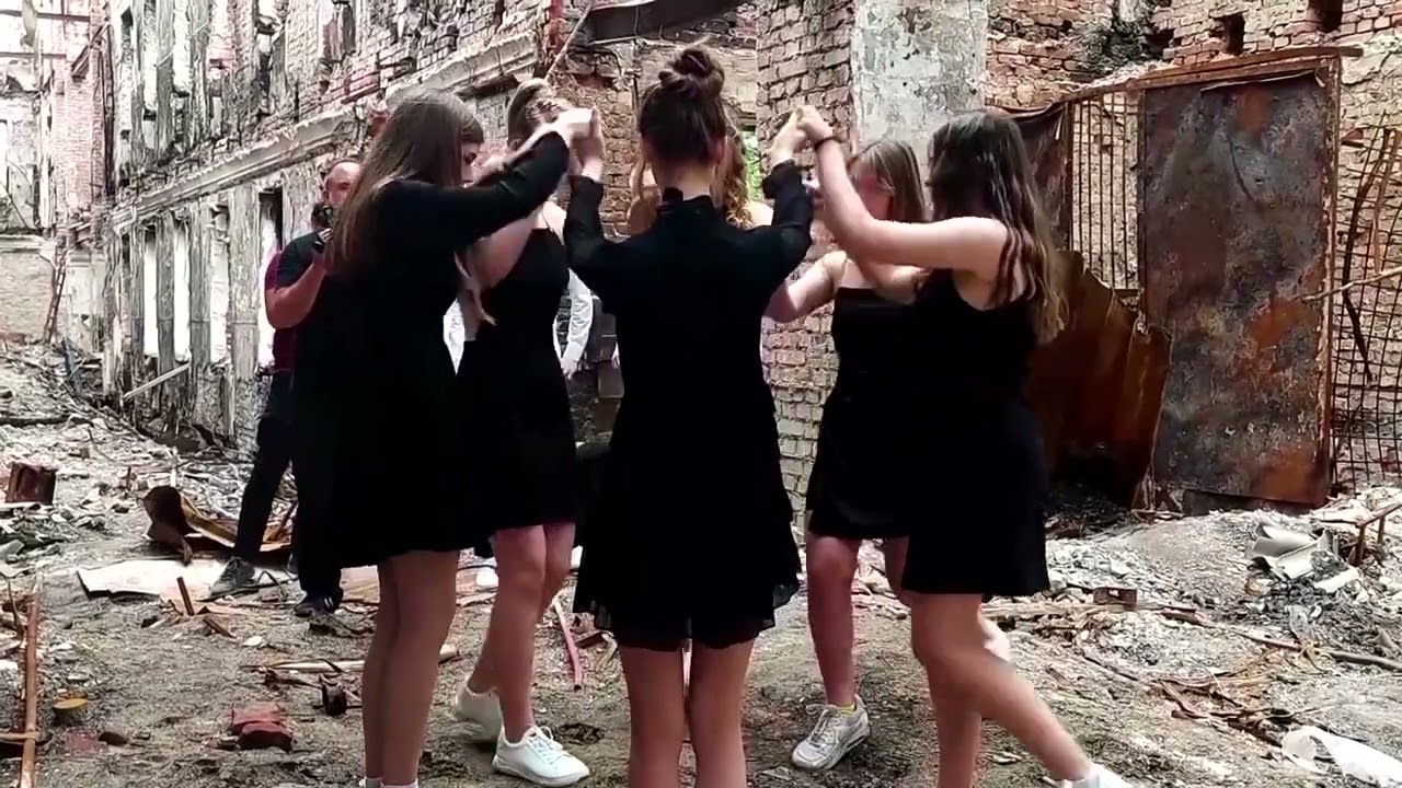 Kharkiv graduates dance in front of destroyed school