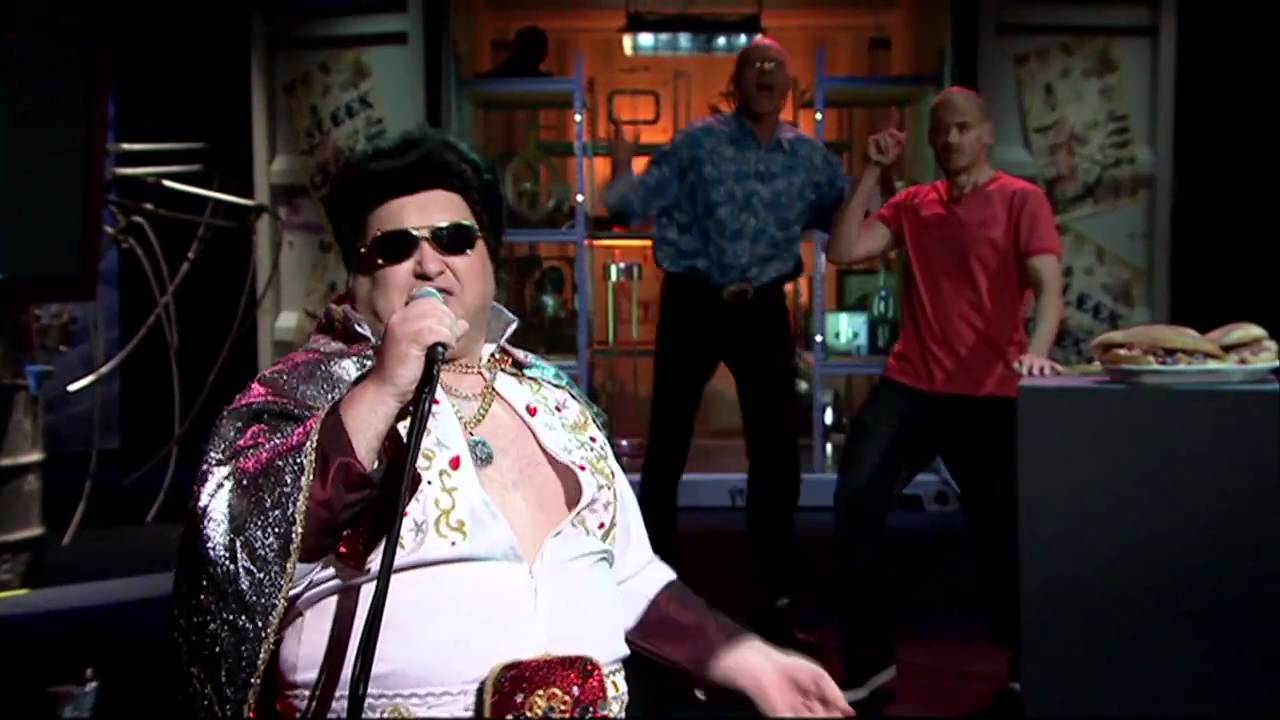 Sleek Geeks with 'Elvis'-Hunk Of Burning Lard