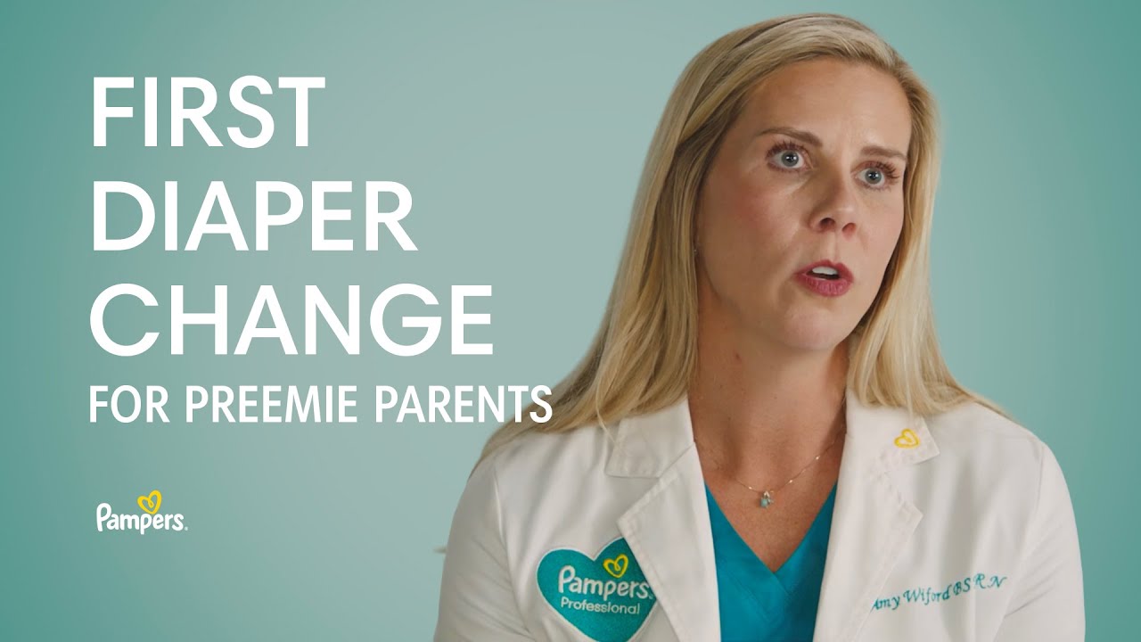 How do preemie parents handle emotional moments like the first diaper change?