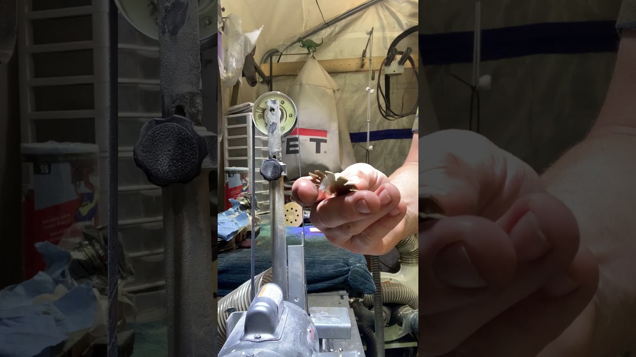 Sharpening an axe on a belt sander