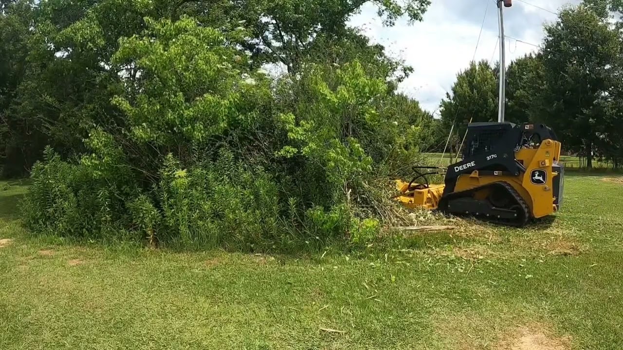 Brush Wolf 7201LF brush cutter on a John Deere 317G by Smallwood's Land Management LLC