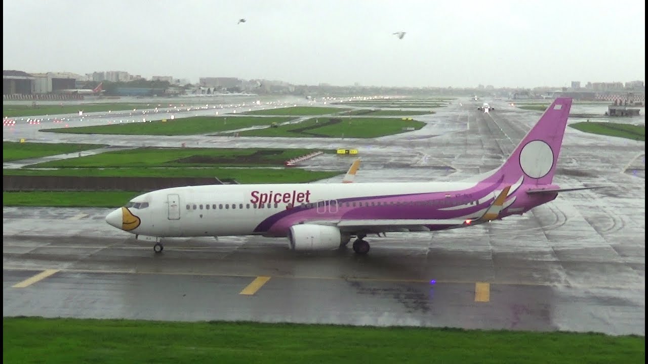 SpiceJet (special livery) waterspray takeoff at Mumbai Airport