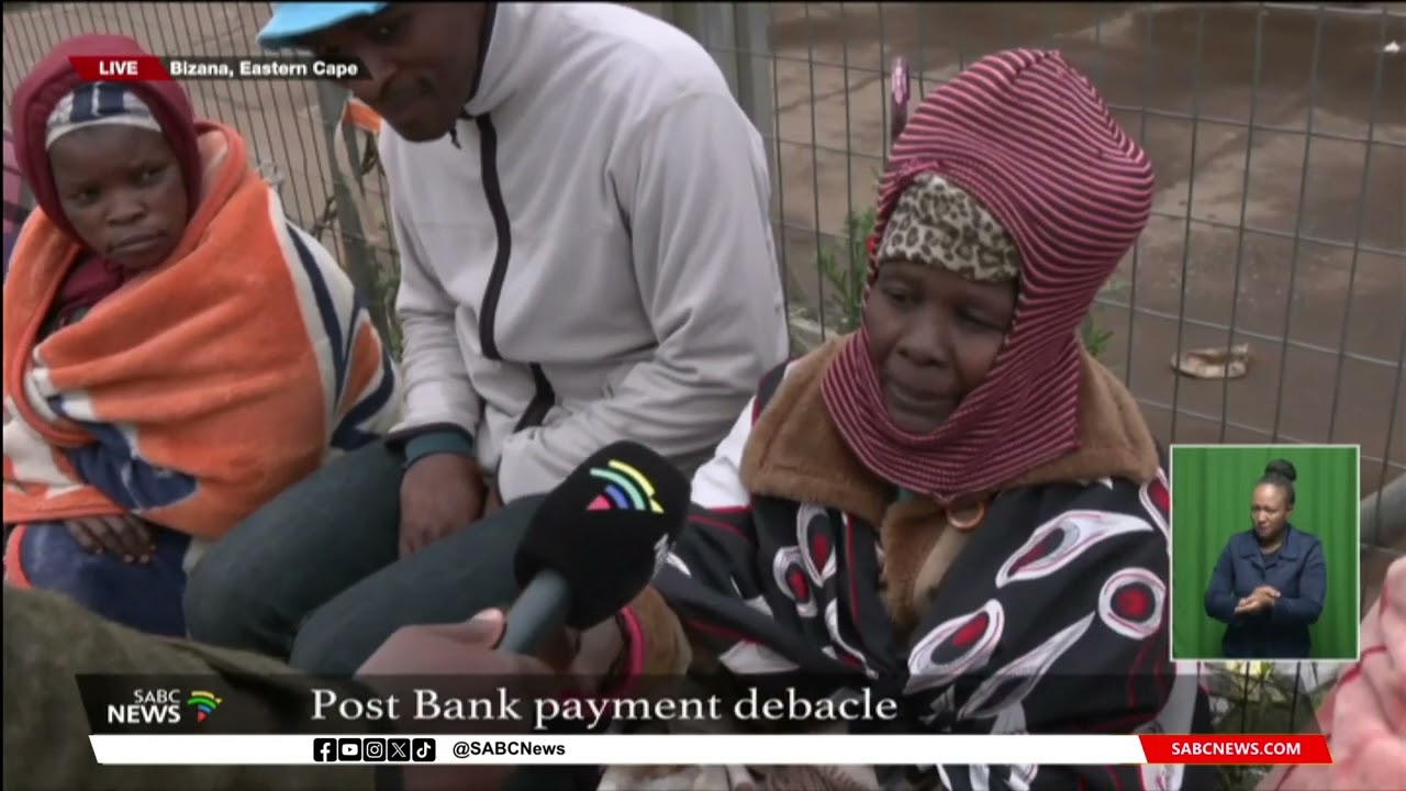 Elderly queue outside Bizana Post Bank awaiting grant pay