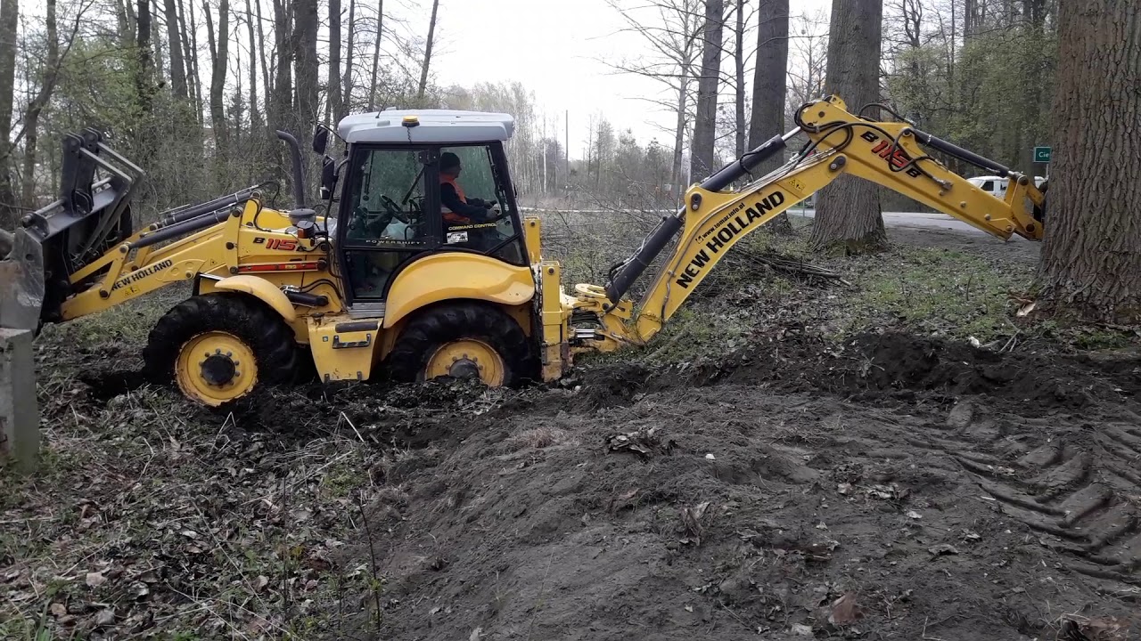 New Holland B115 B utopiony przy wymianie słupa