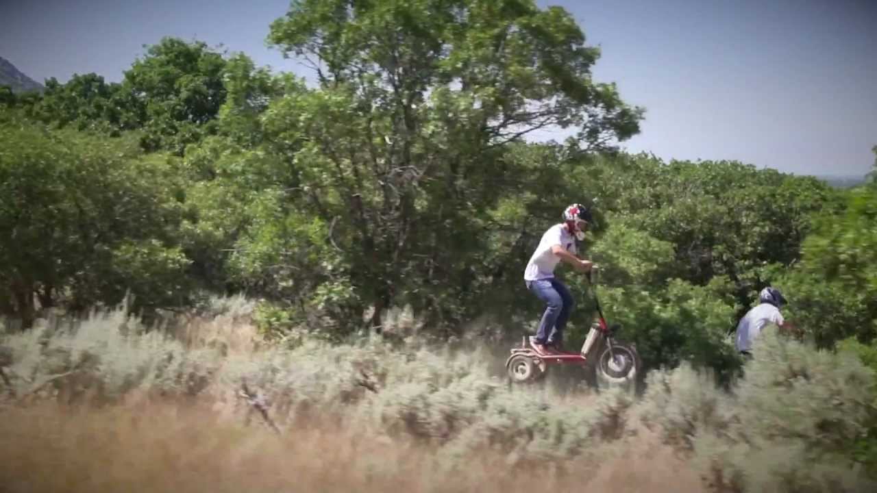 LYRIC Motion Electric Scooter: Trail riding on a mountain bike single track.