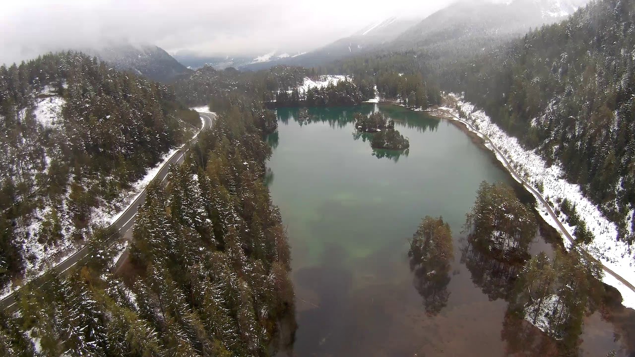 MJX Bugs 5W drone flight over Alps mountain lake at Fernpass, Austria, in snow condition