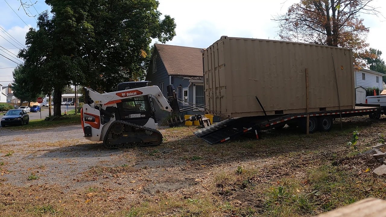 Unloading shipping container with Bobcat T66